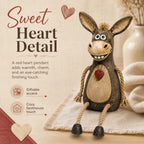 Rustic donkey figure on a plank with dangling rope legs