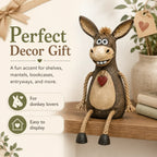 Rustic donkey figure on a plank with dangling rope legs